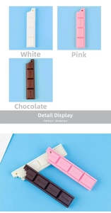 Detailed view of chocolate-shaped ballpoint pens in brown, pink and white colors