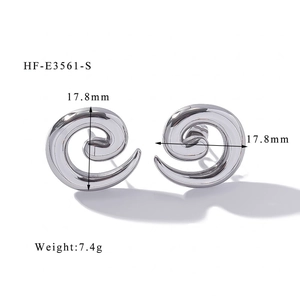 Polished silver spiral earrings with 17.8mm diameter and 7.4g weight in detail view