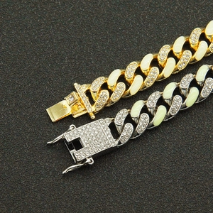 Hip hop iced out Cuban link bracelet in gold and silver with white enamel and glowing rhinestones