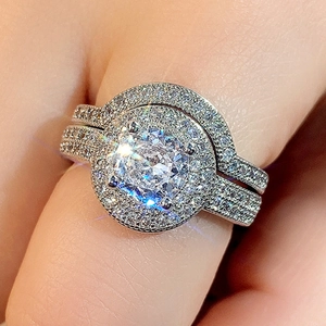 Sparkling bridal halo ring set with micro-paved cubic zirconia in a white gold finish