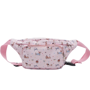 Detail of pink cartoon puppy print fabric and black adjustable strap on chest bag