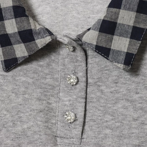 Women's grey knit polo set with black plaid collar and floral rhinestone buttons
