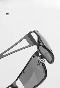 Detail of Y2K metal square sunglasses showing frame texture and screw construction