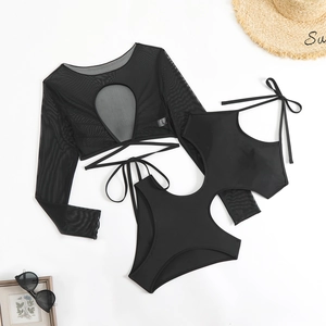 Flat lay of black long sleeve mesh swimwear with teardrop cutout and high waist bikini