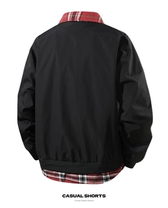 Back view of a black bomber jacket with tartan collar and layered hem design