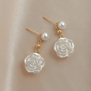 Elegant acrylic camellia flower earrings with white faux pearls and gold finish hooks