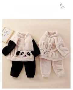 Detail of plush flannel kids pajamas set with cute panda and rabbit animal hood ears