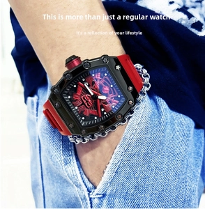 Detail of red samurai embossed dial and black tonneau bezel on a sporty men's watch