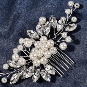 Handmade bridal hair comb with white pearls and marquise rhinestones on blue denim