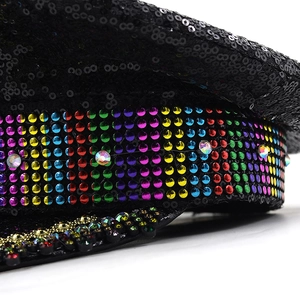 Macro detail of black sequins and rainbow rhinestones on this festive captain hat