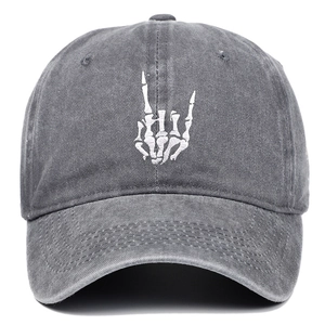 Close-up of rock bone embroidery on washed cotton grey baseball cap with fine stitching
