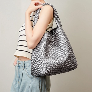 Handwoven silver PU leather tote bag with a spacious hobo design and metallic finish