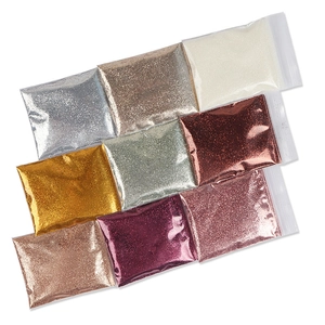Macro shot of 9 colorful 0.2mm fine glitter powder bags for professional nail art designs