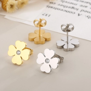 Minimalist clover stud earrings in gold and silver with cubic zirconia insets