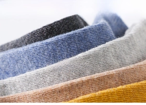 Close-up of premium ribbed cotton knit fabric showing breathable texture and fibers