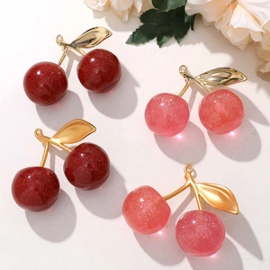 Sparkly cherry pendant accessories with gold leaf detail for DIY keychains and bags