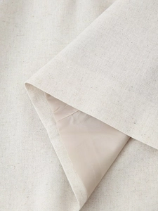 Detail view of premium beige linen blend fabric with refined texture and smooth lining