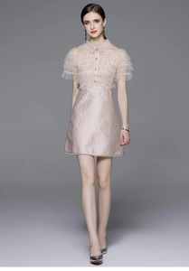 Detail of pink sequins mesh ruffles and high-waisted metallic jacquard patchwork dress