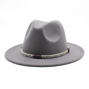 Detail of dark grey wool felt fedora featuring a braided band and wide stiff brim