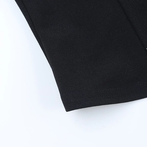 Close-up of black lace camisole showing neat double-row stitching and premium fabric texture