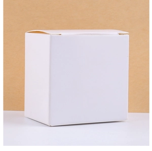 Minimalist square white paper gift box packaging for spooky ghost candles on two-tone base