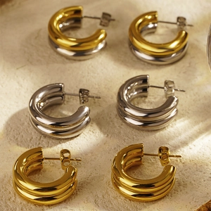 French vintage C-shaped hoop earrings in gold, silver and two-tone polished stainless steel