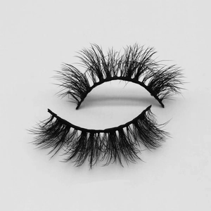 Close-up of thick black mink-style eyelashes with natural volume and curved texture