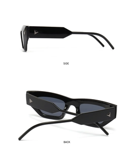 Detail view showing the side and back of black cat-eye sunglasses with metal triangle accents