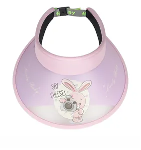 Detail view of pink UV sun visor for kids with cute cartoon rabbit and adjustable strap