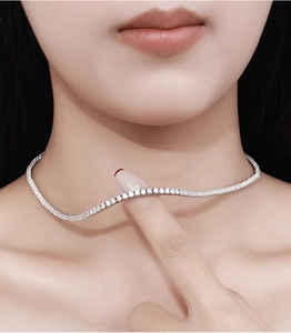 Close-up of elegant 925 sterling silver tennis necklace with 2.5mm moissanite on neck