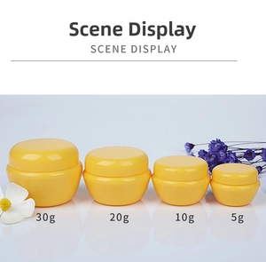 Set of four yellow mushroom cream jars in 5g 10g 20g 30g sizes for cosmetic packaging