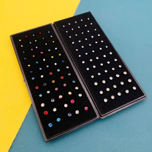 Bulk set of stainless steel nose studs with colorful crystals in black display boxes