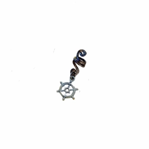Detailed view of spiral dreadlock metal bead with a vintage nautical helm charm pendant
