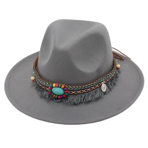 Close-up of bohemian fedora hat featuring colorful beads and turquoise stone detailing