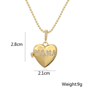 Detail of gold heart pendant with MAMA crystal inlay showing dimensions 2.8cm and 2.1cm