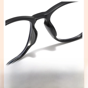 Detailed macro shot of the integrated nose pads on black kids' blue light glasses
