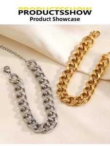 Detailed shot of polished gold and silver Cuban link bracelets with lobster clasp closure