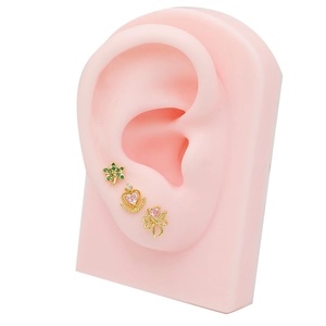 Three-piece gold titanium steel cartilage earrings with star, crown and bow designs
