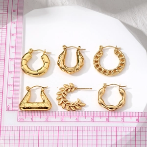 Set of six gold geometric hoop earrings including twisted rope and wheat patterns