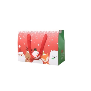 Christmas gift bag with cartoon Santa and reindeer patterns and red ribbon handles