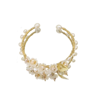 Handmade pearl flower bangle with gold wire wrap and shell petal details for women