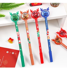 Close-up of Christmas gel pens with reindeer horns and festive sequin liquid balls
