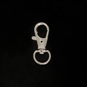 Detail of silver alloy swivel lobster clasp with rotating base for DIY keychain making