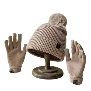 Winter knit set featuring a khaki beanie with fur pom and touchscreen gloves for adults