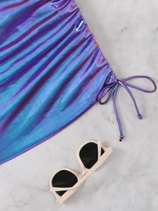 Detail of iridescent purple bikini with metallic fabric and side ruched drawstring