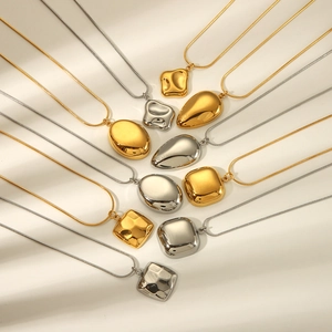 Minimalist 18K gold and silver geometric pendant necklaces on sleek snake chains