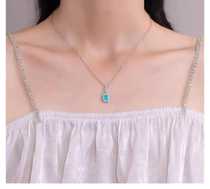 Detail of s925 silver perfume bottle necklace with blue opal and small zircons