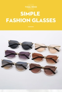 Detail of cat eye sunglasses with golden metal chain trim in various gradient colors