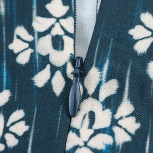 Macro view of blue printed fabric with a seamless concealed zipper on the skort
