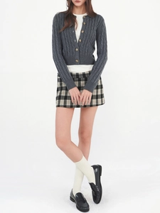 Preppy grey cable knit cardigan styled with a plaid miniskirt and loafers set